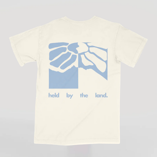 Held by the Land Tee